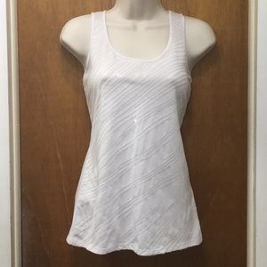 Off white tank with shimmering details.